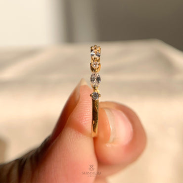 Elegant half eternity ring featuring marquise and round cut diamonds