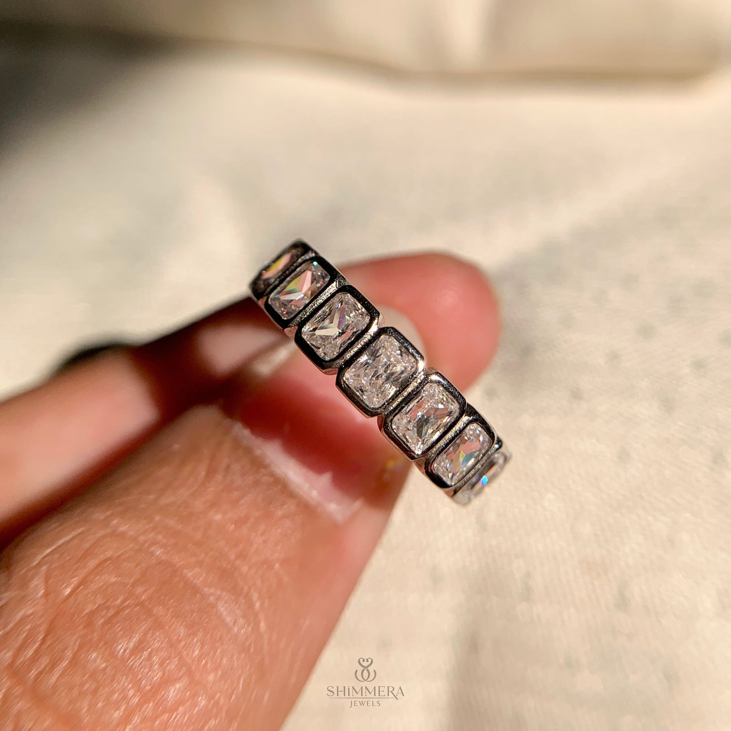 Stylish radiant cut bezel set wedding band with modern design