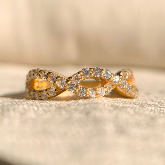 Half infinity pavé diamond engagement ring in white gold setting