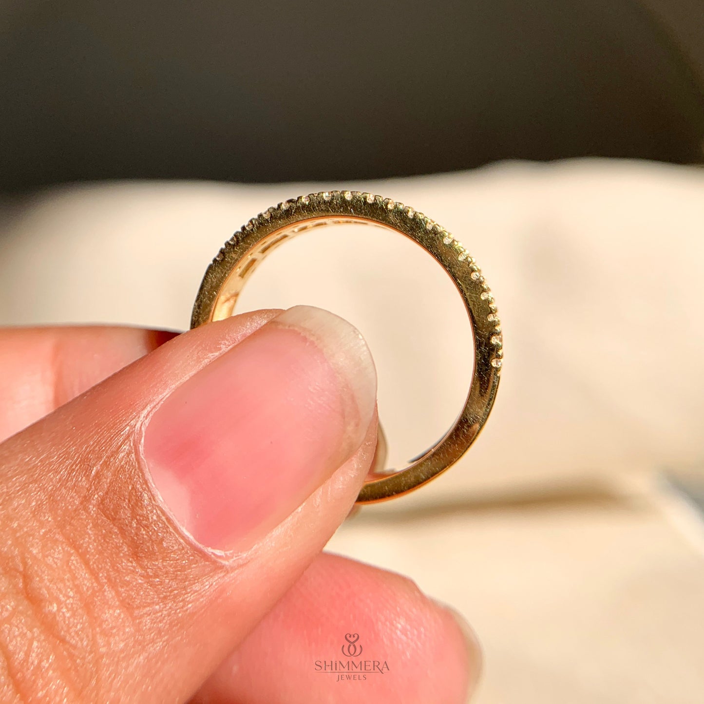 Women’s diamond half eternity wedding band with baguette and round stones
