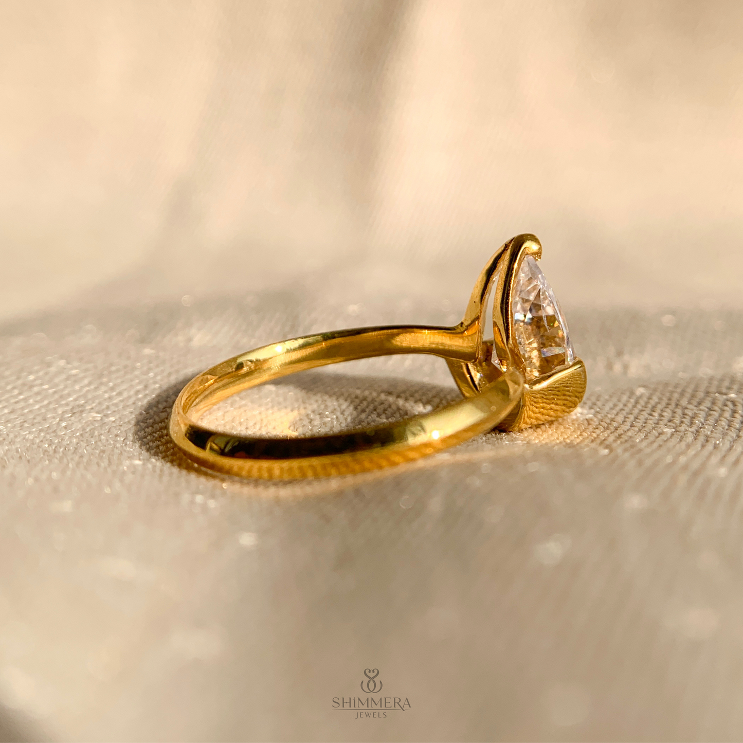 Half Bezel Pear Diamond Ring