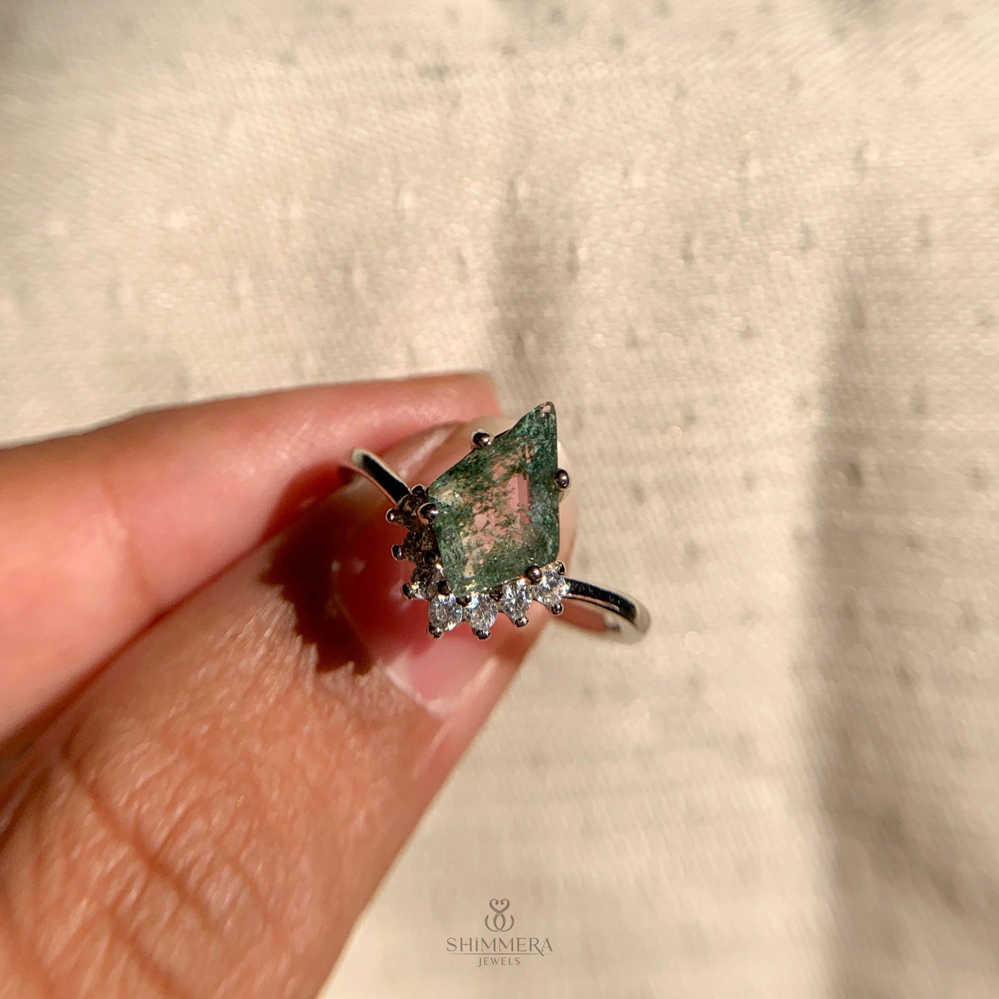 Vintage-style sterling silver engagement ring with moss agate center and diamonds