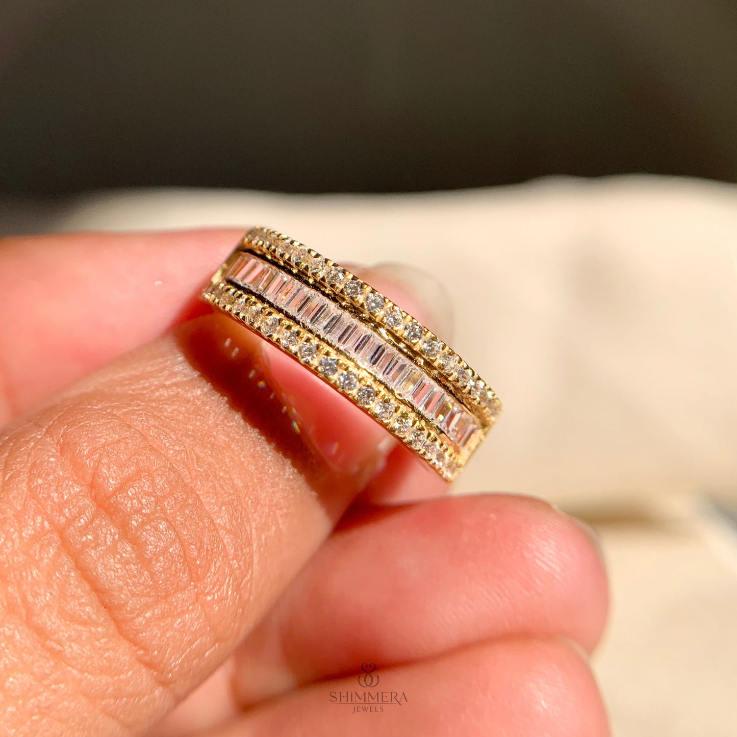 Classic round and baguette diamond anniversary ring in 14k gold
