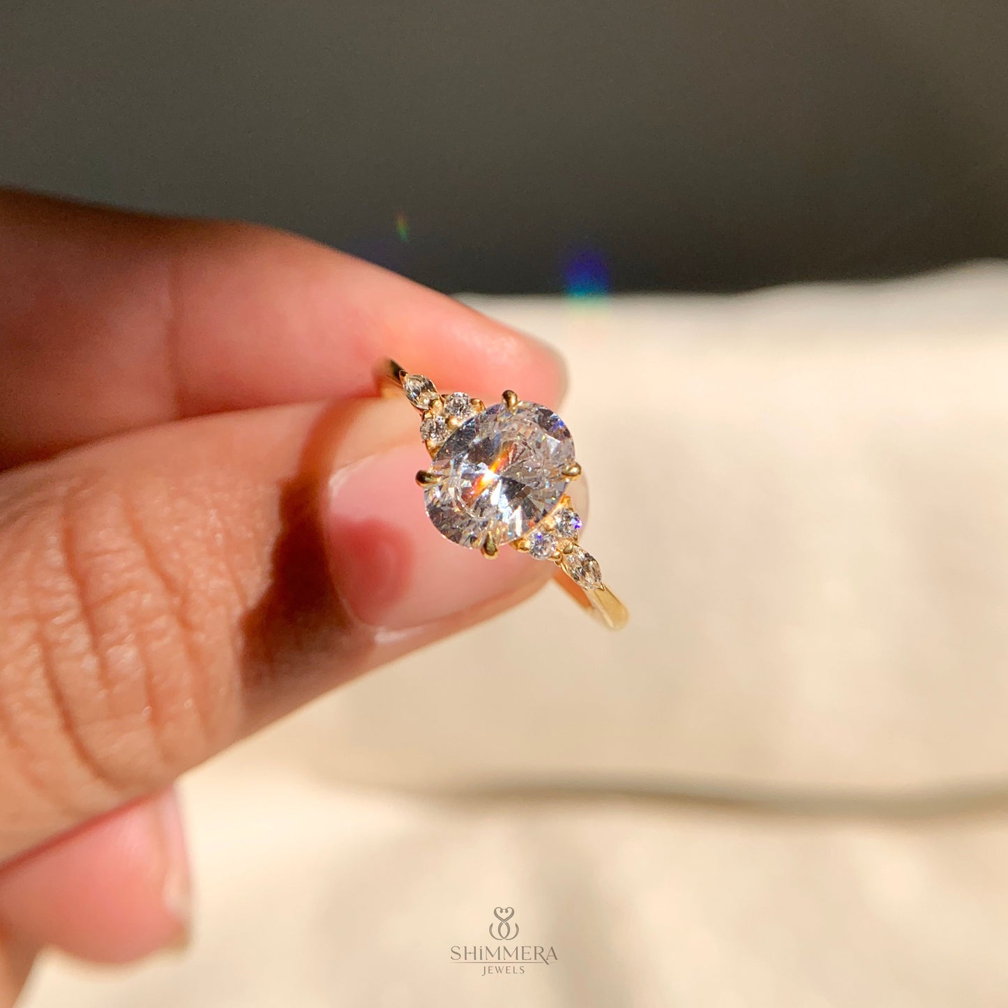 Timeless oval diamond engagement ring with side accents