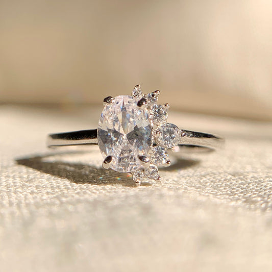 "1 carat oval lab grown diamond cluster engagement ring in white gold"