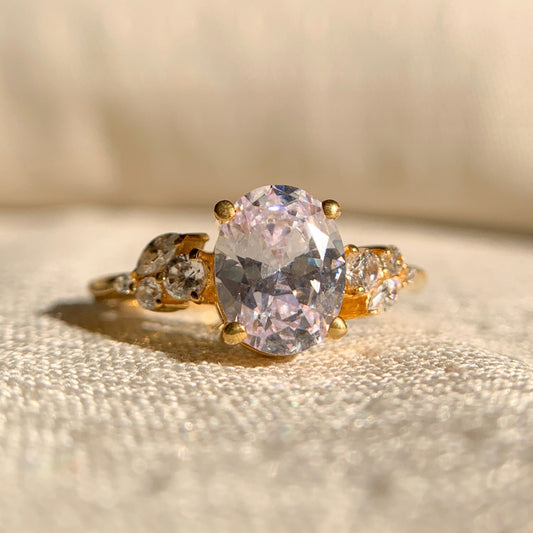 1.75CT oval side stone engagement ring in 14k gold