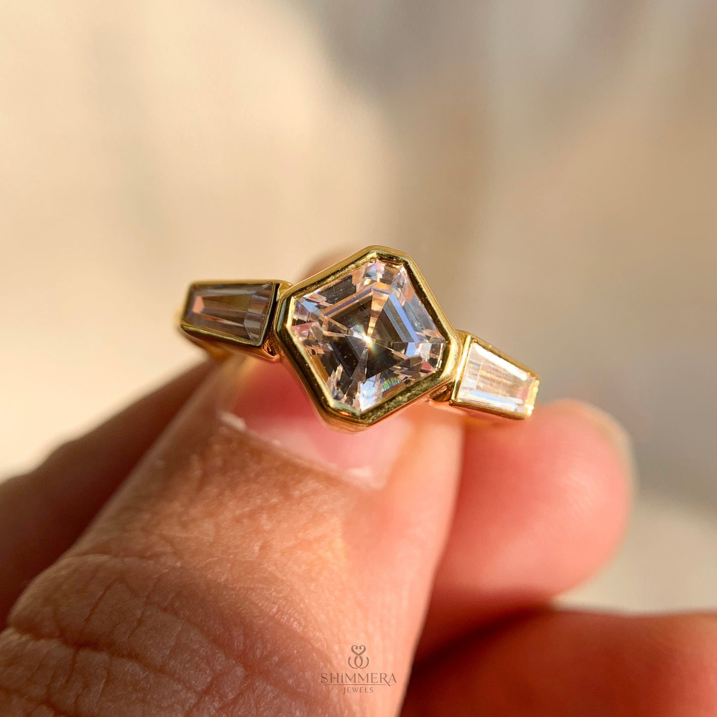 Classic Asscher and baguette three stone ring crafted for engagement proposals