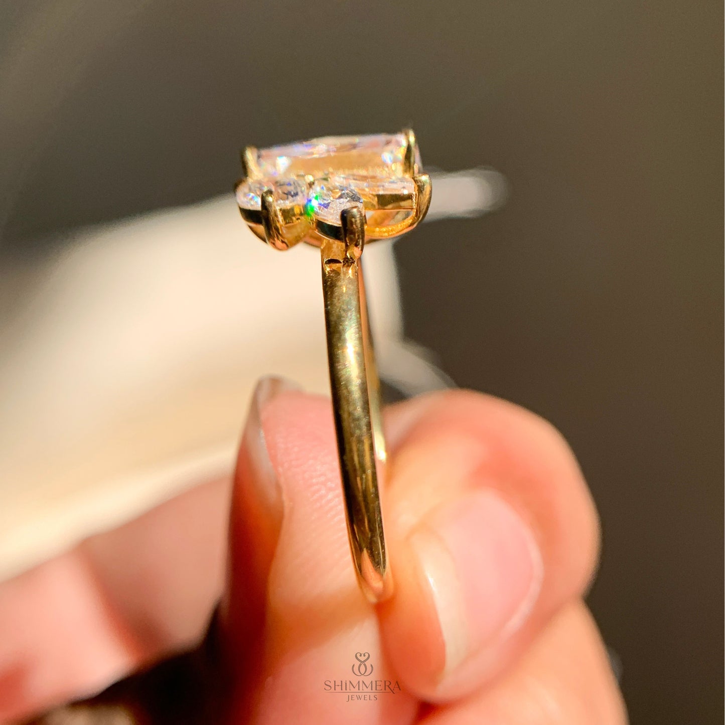 Radiant emerald cut moissanite engagement ring in yellow gold