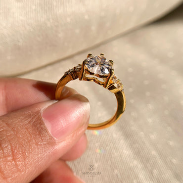 Romantic heart shape engagement ring featuring pave side accent diamonds