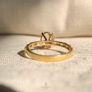 Elegant oval moissanite ring featuring side diamonds for modern brides