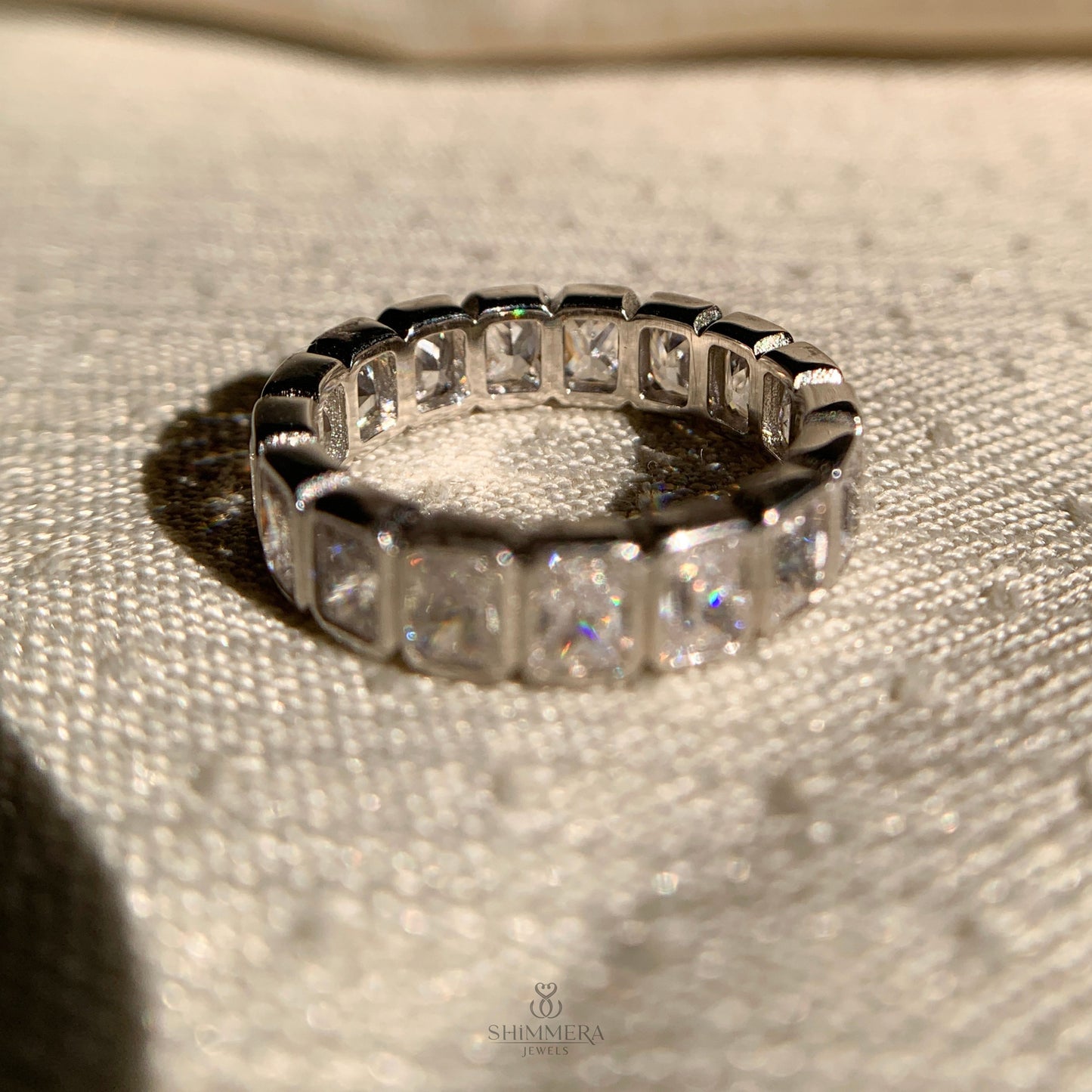 Radiant cut bezel set wedding band showcasing premium craftsmanship