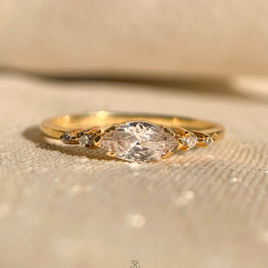 Gold east-west marquise diamond ring with sleek minimalist band