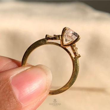 Elegant Round Moissanite Ring Featuring Sparkling Side Stones