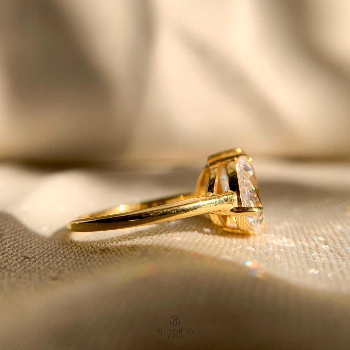 Modern two stone engagement ring featuring pear cut moissanite gemstones