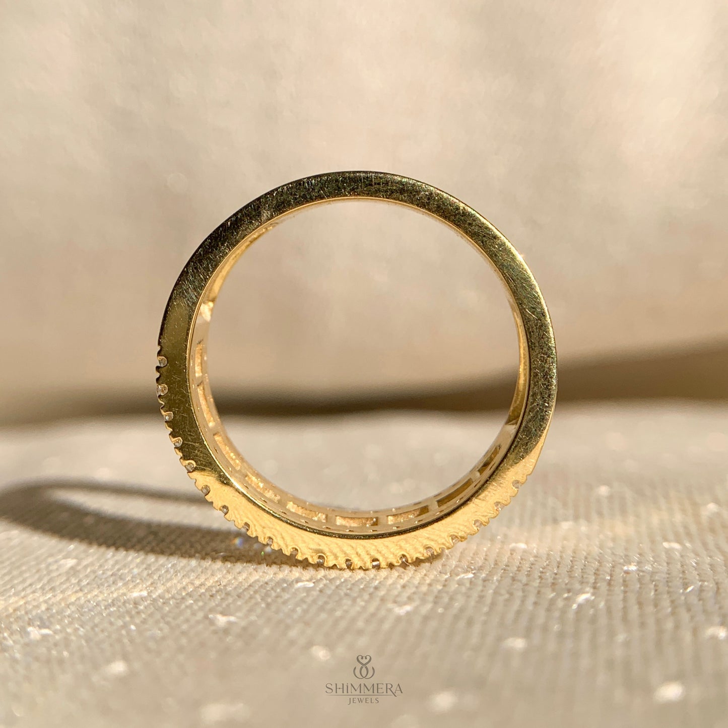 Half eternity diamond band with alternating baguette and round cuts