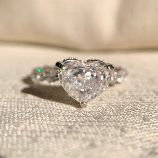“Elegant lab diamond engagement ring with sparkling side stones in classic setting”