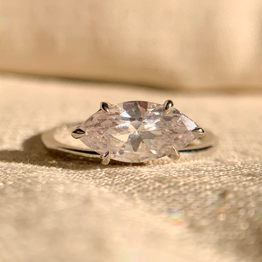 Curved women’s wedding band designed to fit pear shaped engagement ring