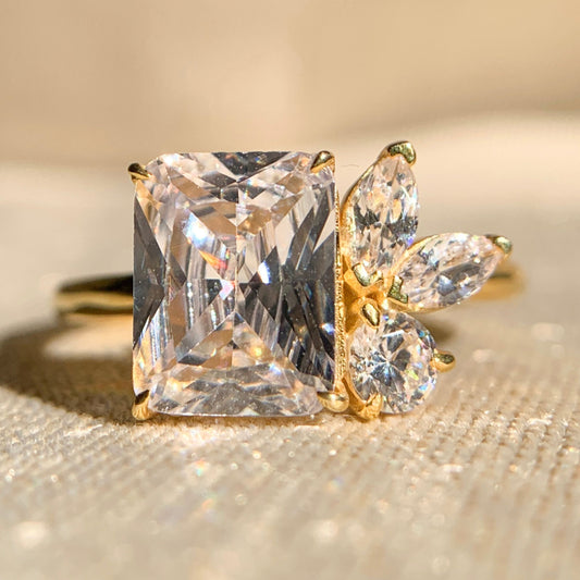 Emerald cut moissanite engagement ring with classic solitaire setting