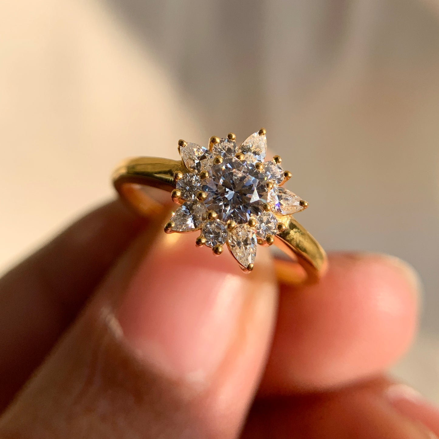 “Timeless yellow gold cluster diamond ring with flower motif”