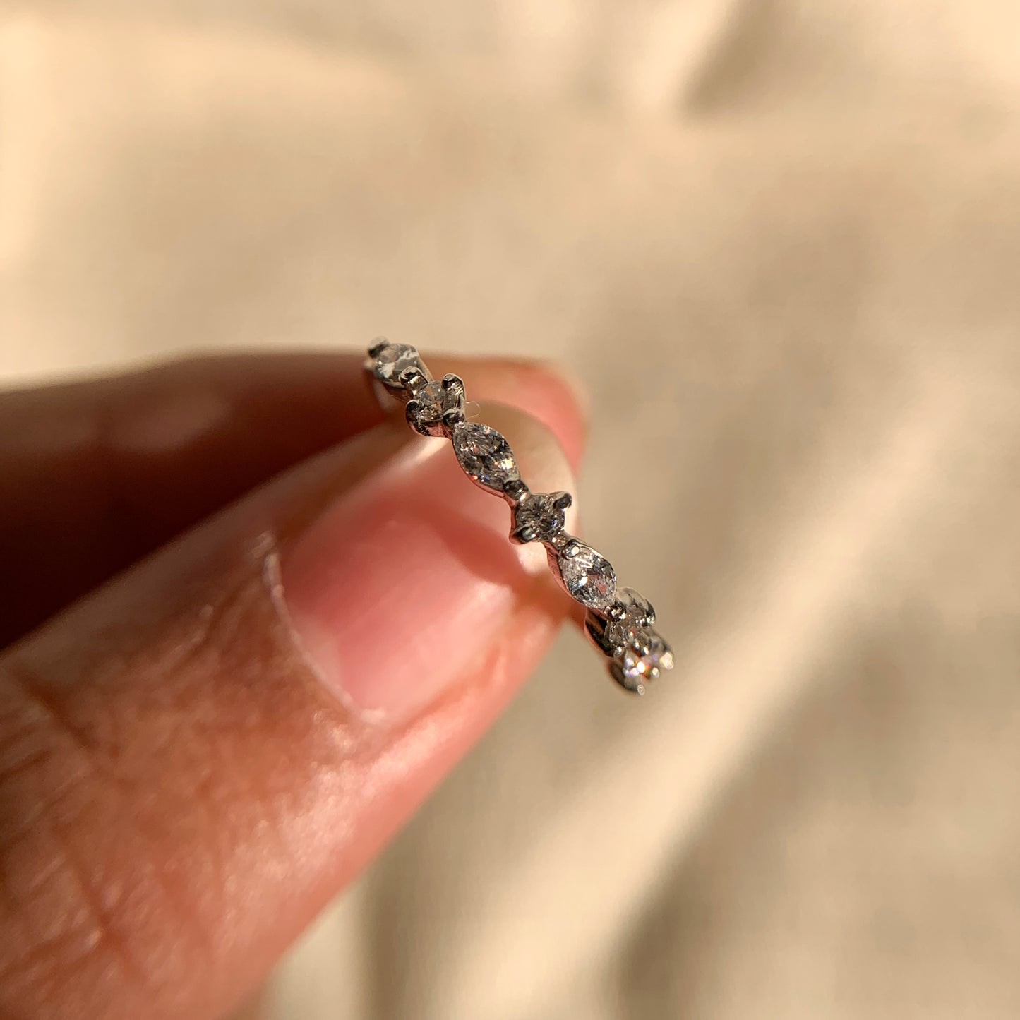 Modern marquise and round diamond band with sleek gold shank