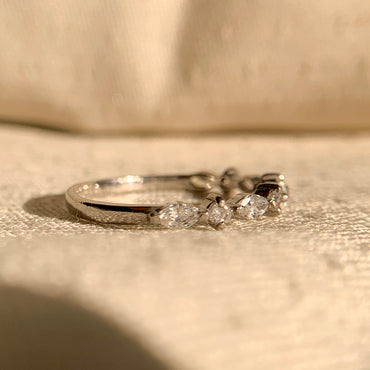 Unique marquise diamond ring with round side stones horizontal design