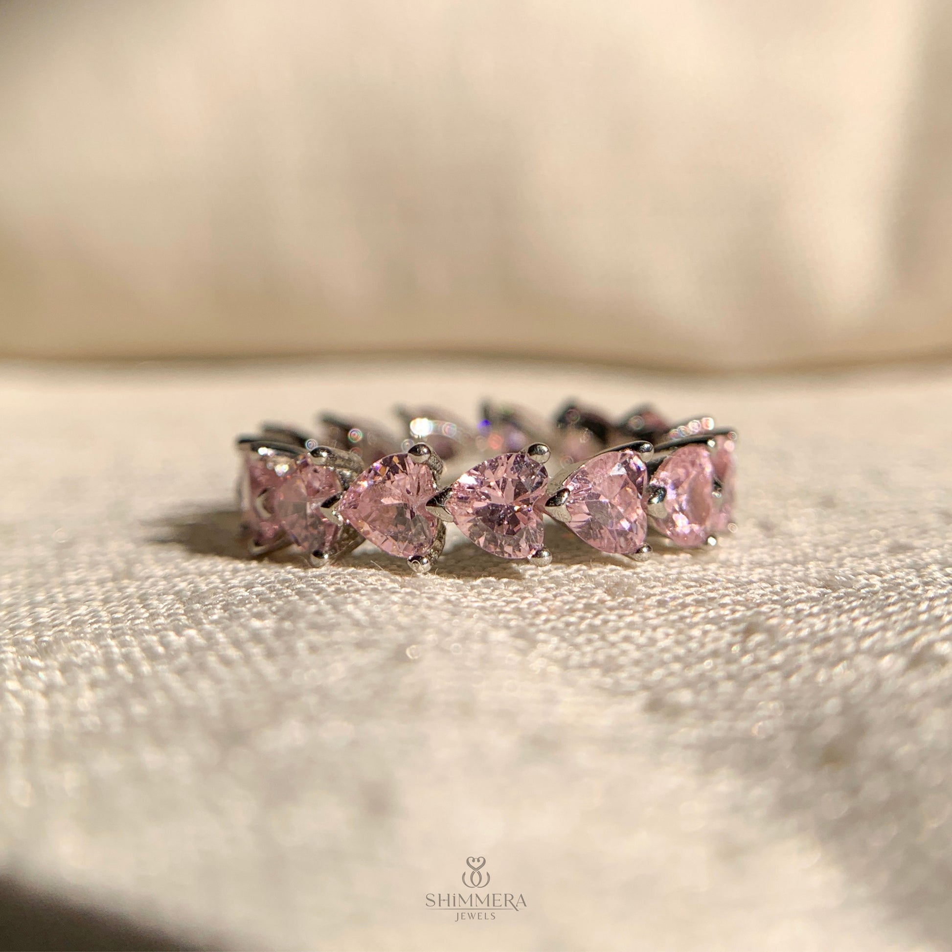 Women’s eternity wedding ring with heart cut diamonds all around