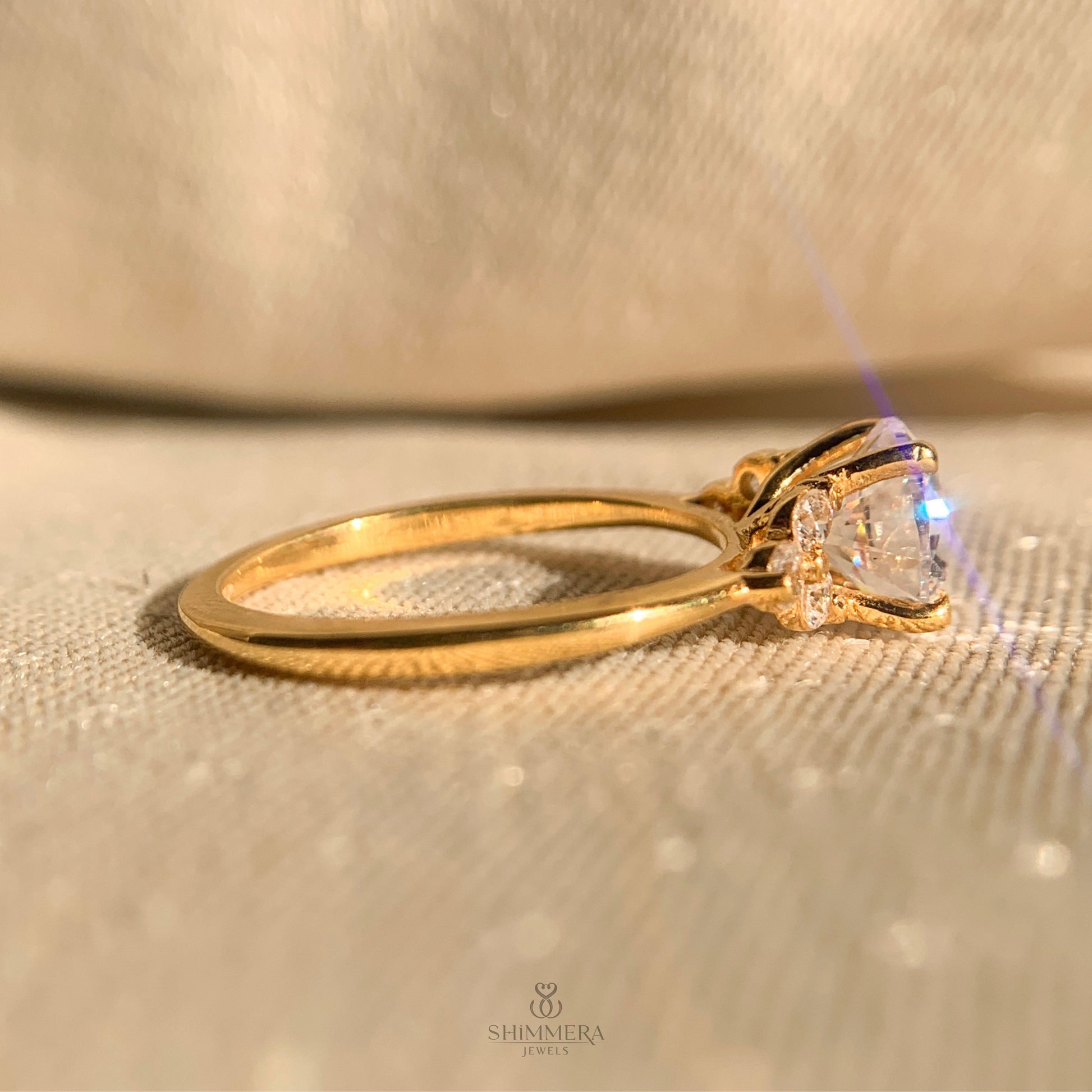Luxury round cut diamond ring with side stone detailing