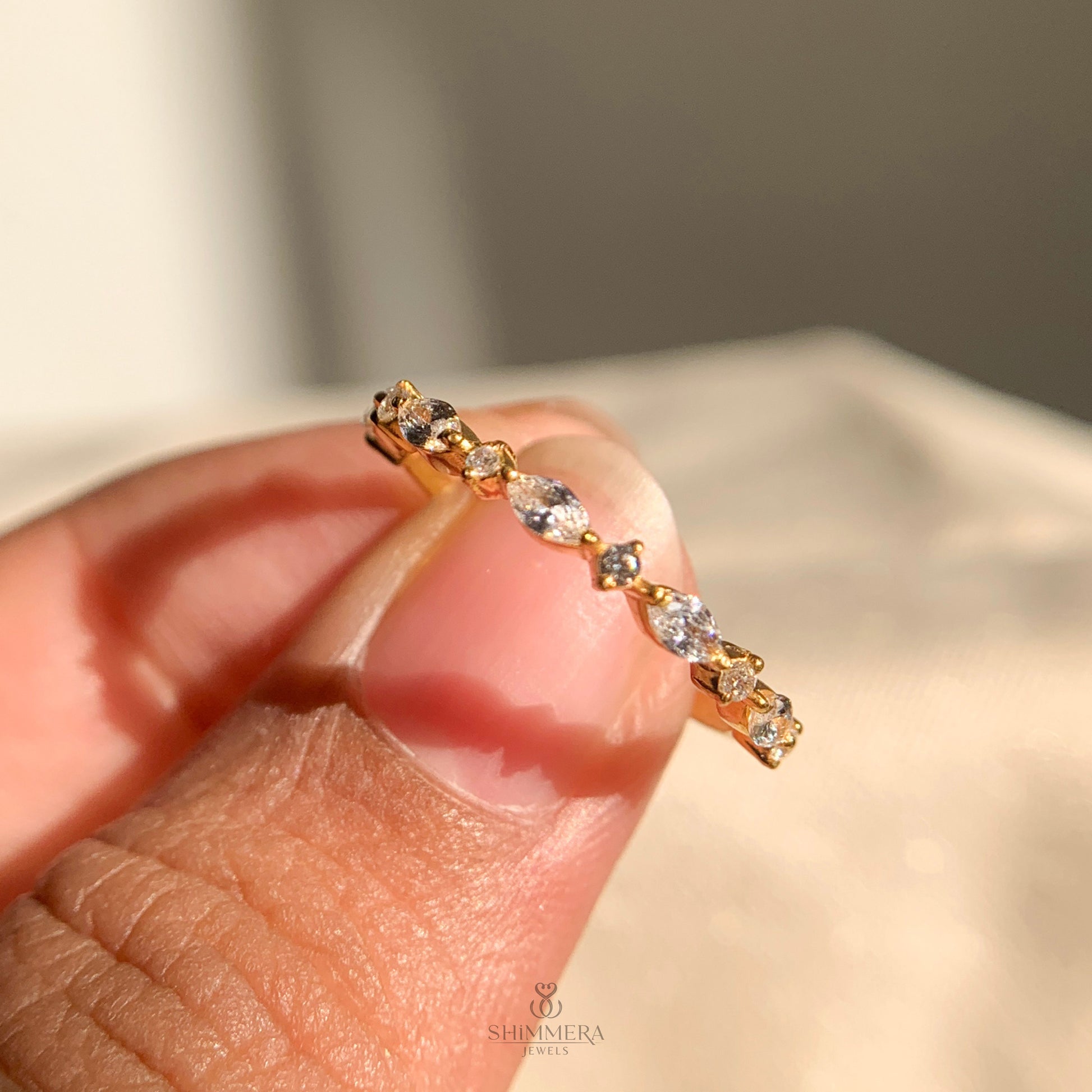 Women’s diamond half eternity band with alternating marquise and round stones