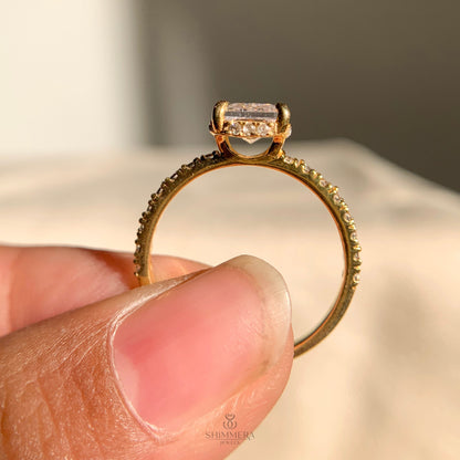 Sparkling radiant moissanite ring featuring a concealed halo setting