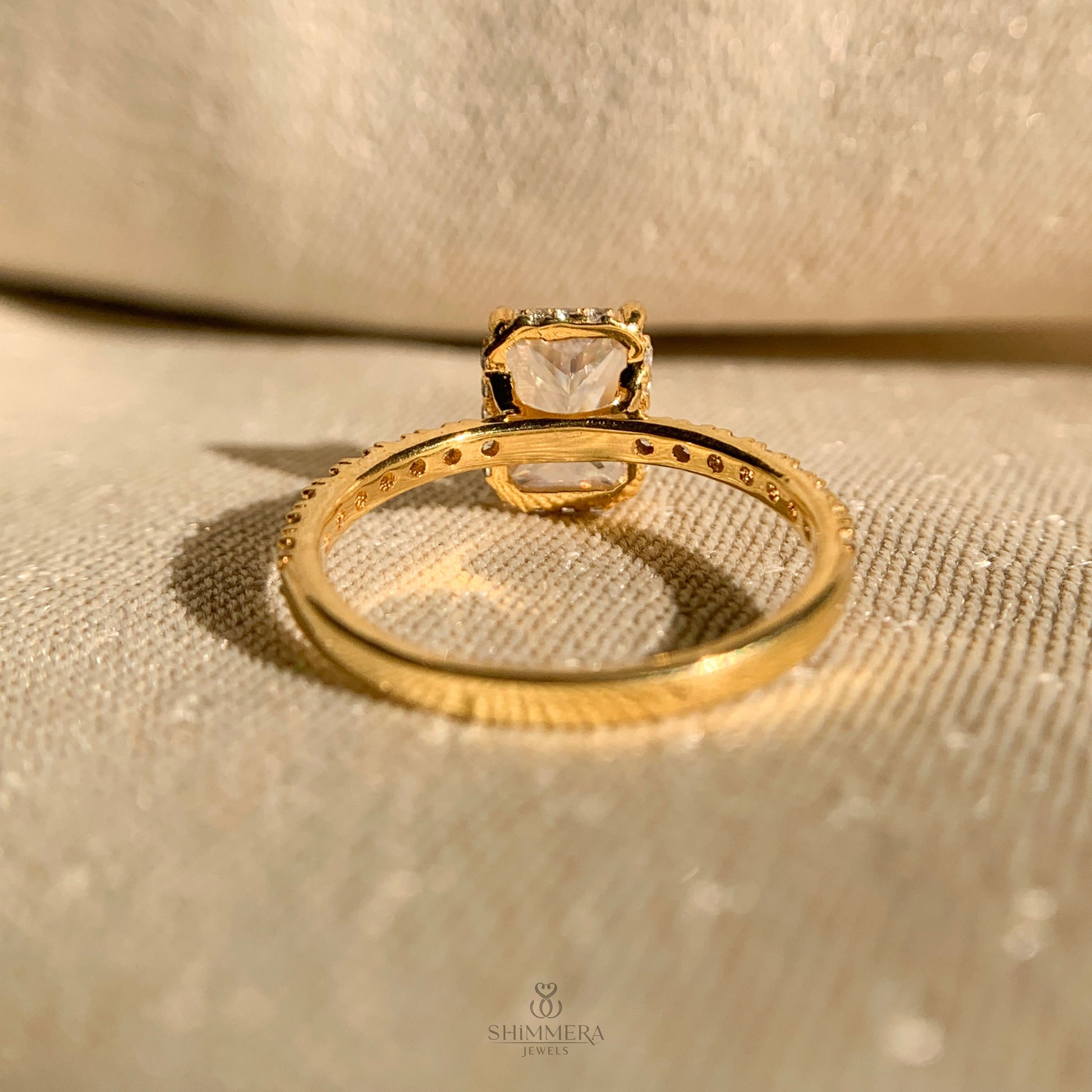 Elegant radiant cut moissanite solitaire with hidden halo accents