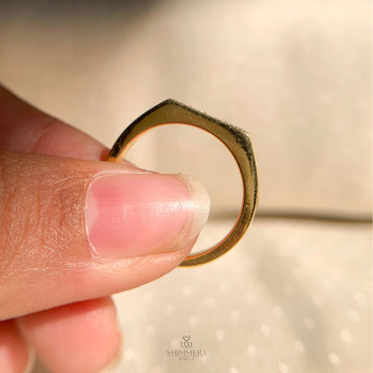 Dainty yellow gold band with five round brilliant diamonds