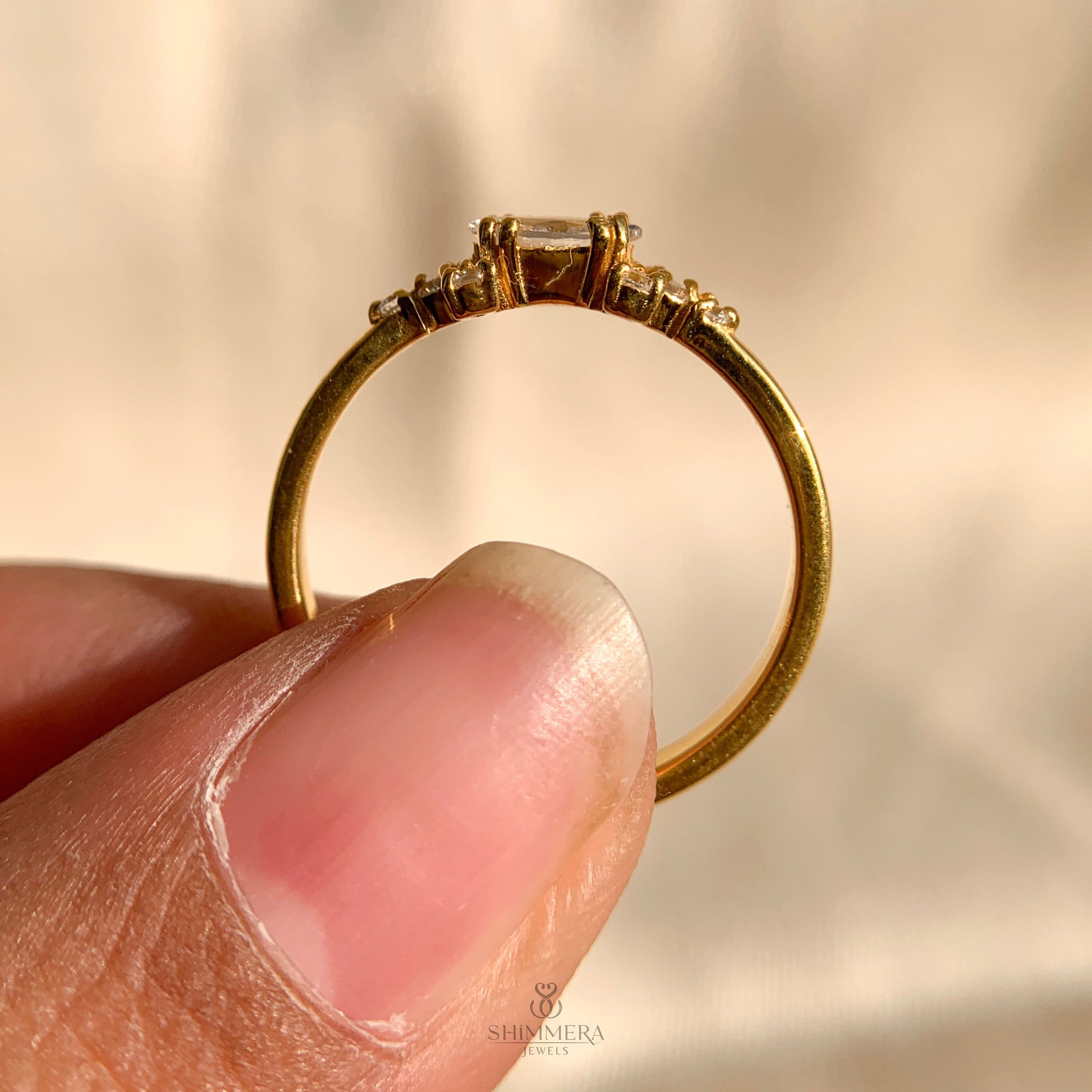 Luxury diamond engagement ring with marquise cut side stones