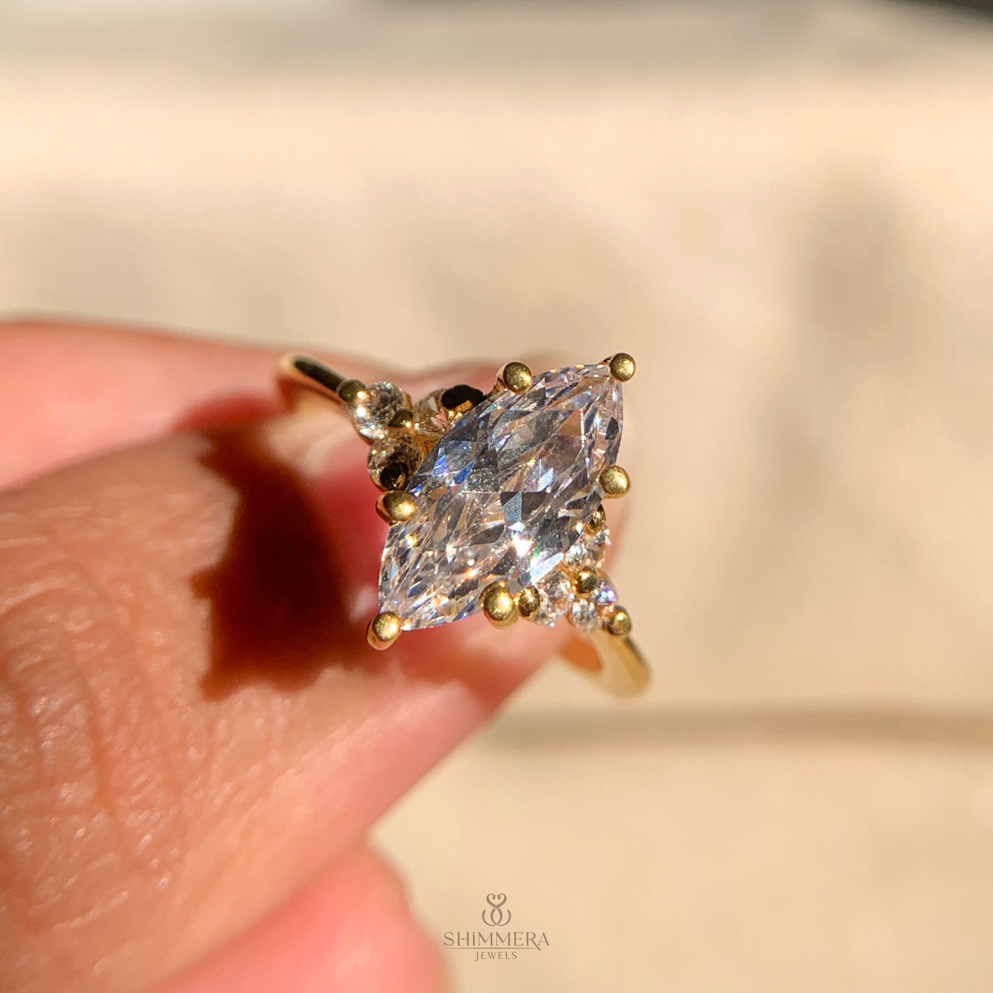 Marquise Engagement Ring With Round Side Stones