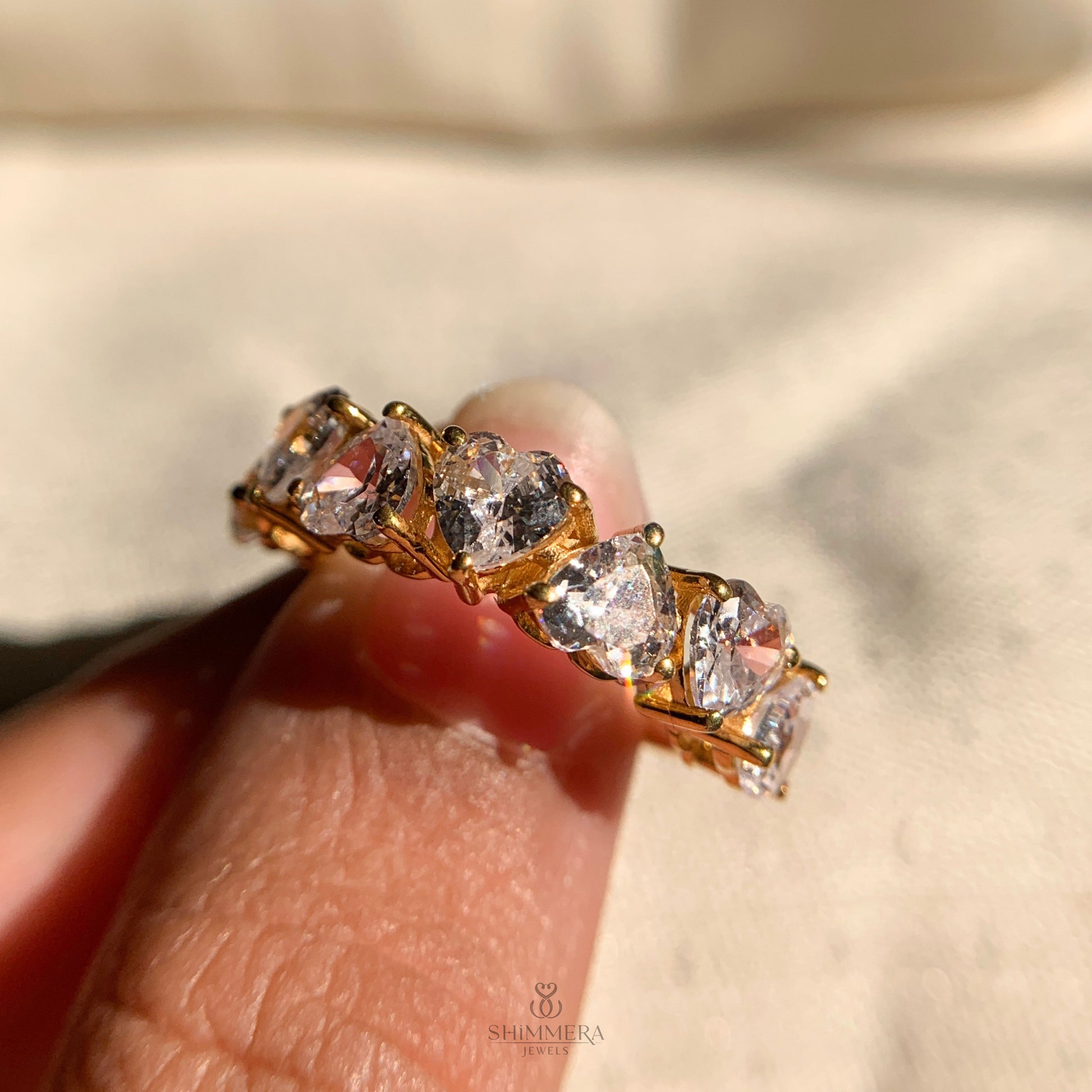 Dainty heart shaped diamond wedding band with alternating pattern