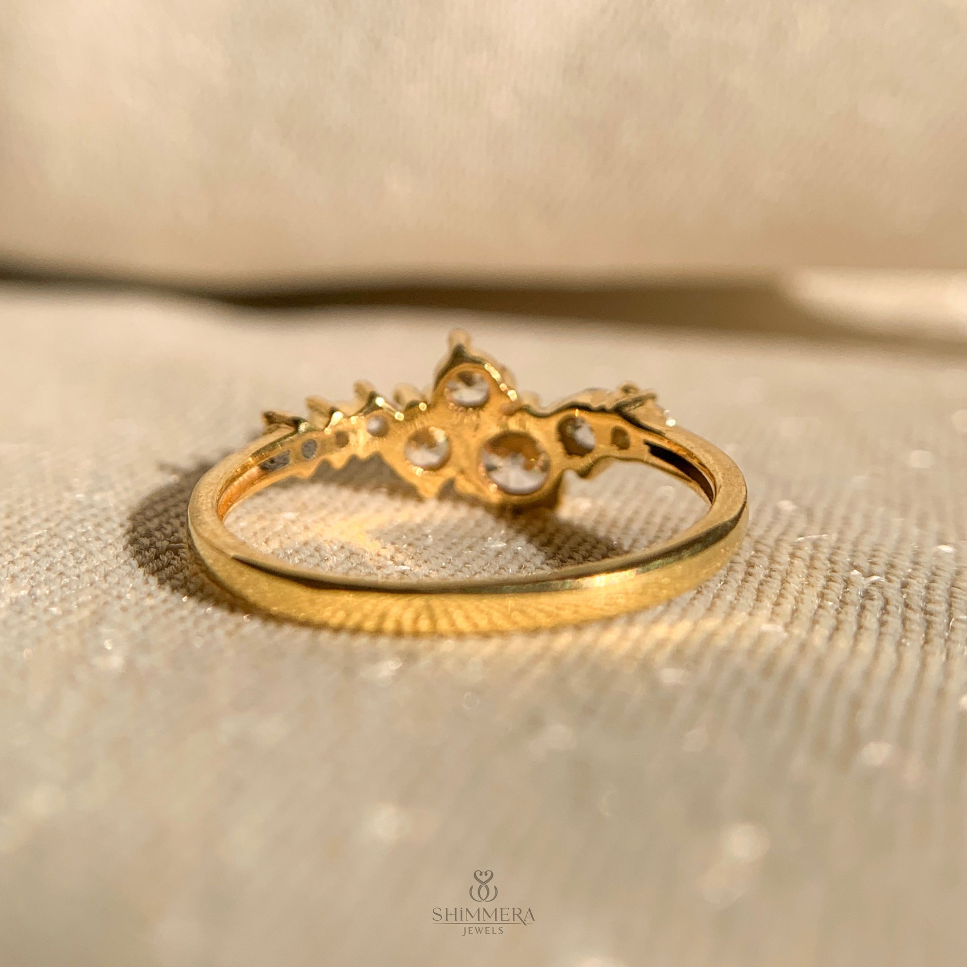 Round cut moissanite diamond cluster ring set in polished gold band