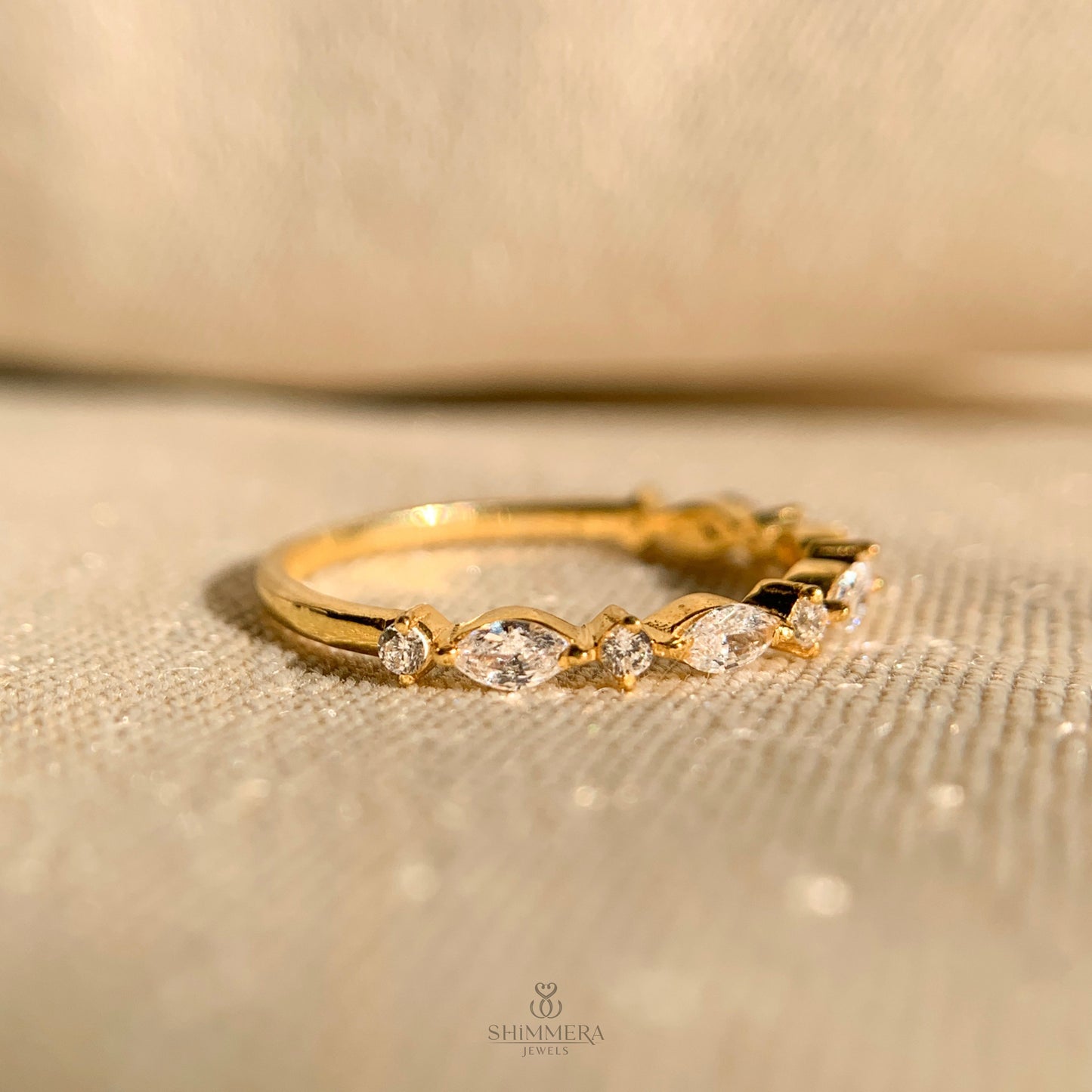 Classic half eternity ring with marquise and round diamonds for brides