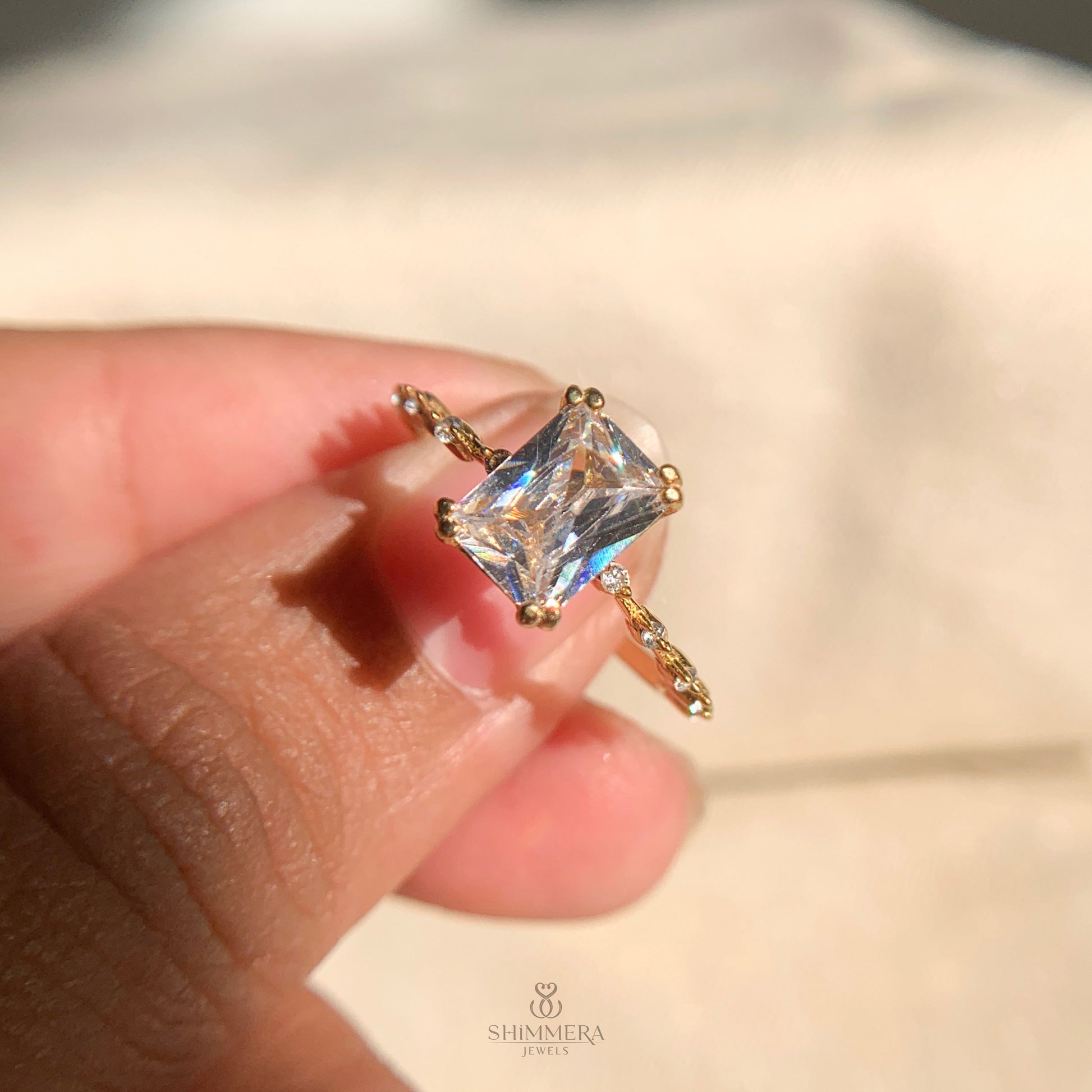 Modern radiant cut engagement ring with classic side stone setting