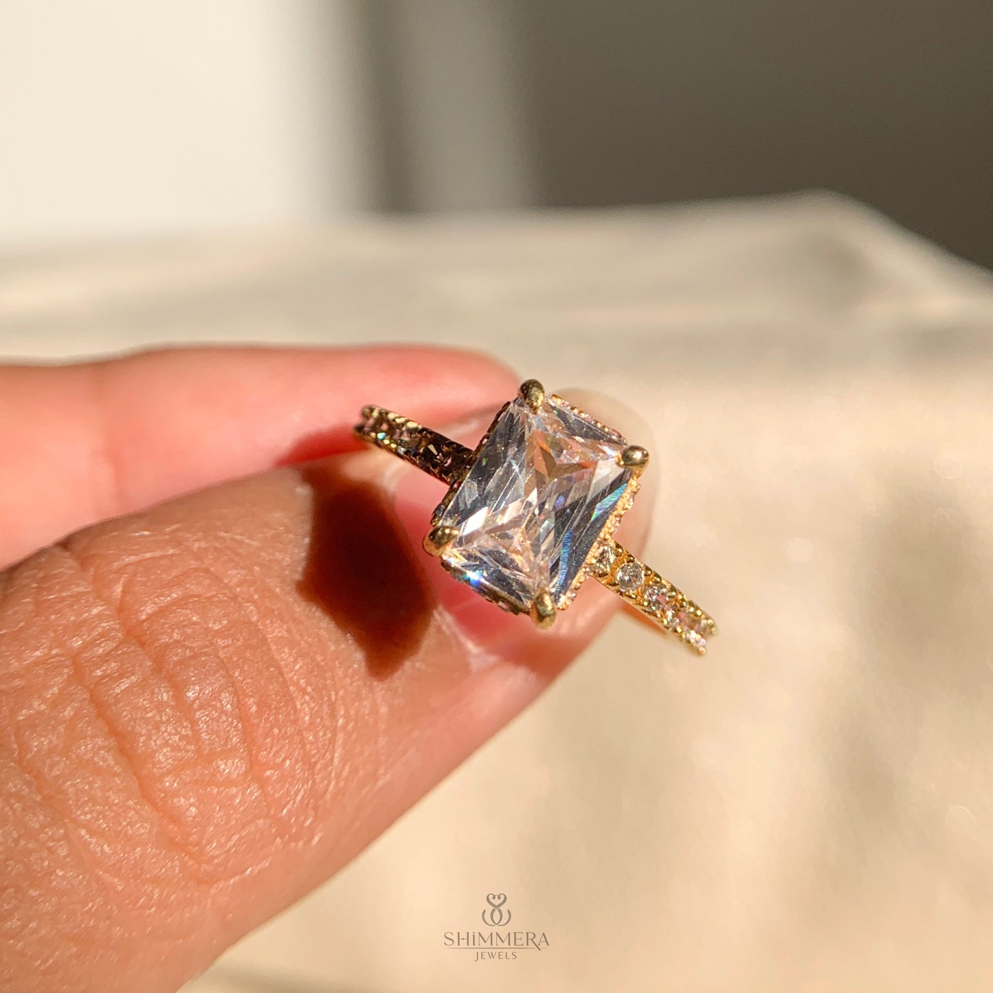 Hidden halo radiant moissanite engagement ring in platinum finish