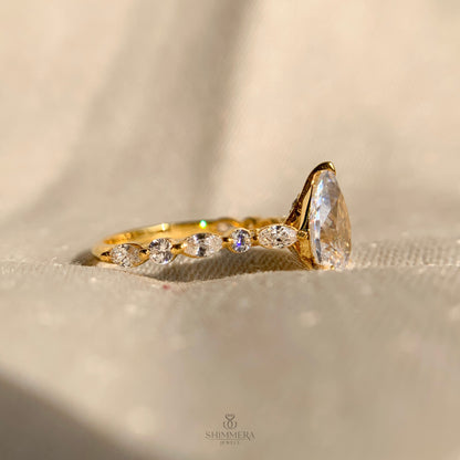 Pear Shaped Diamond Engagement Ring With Marquise Side Accents