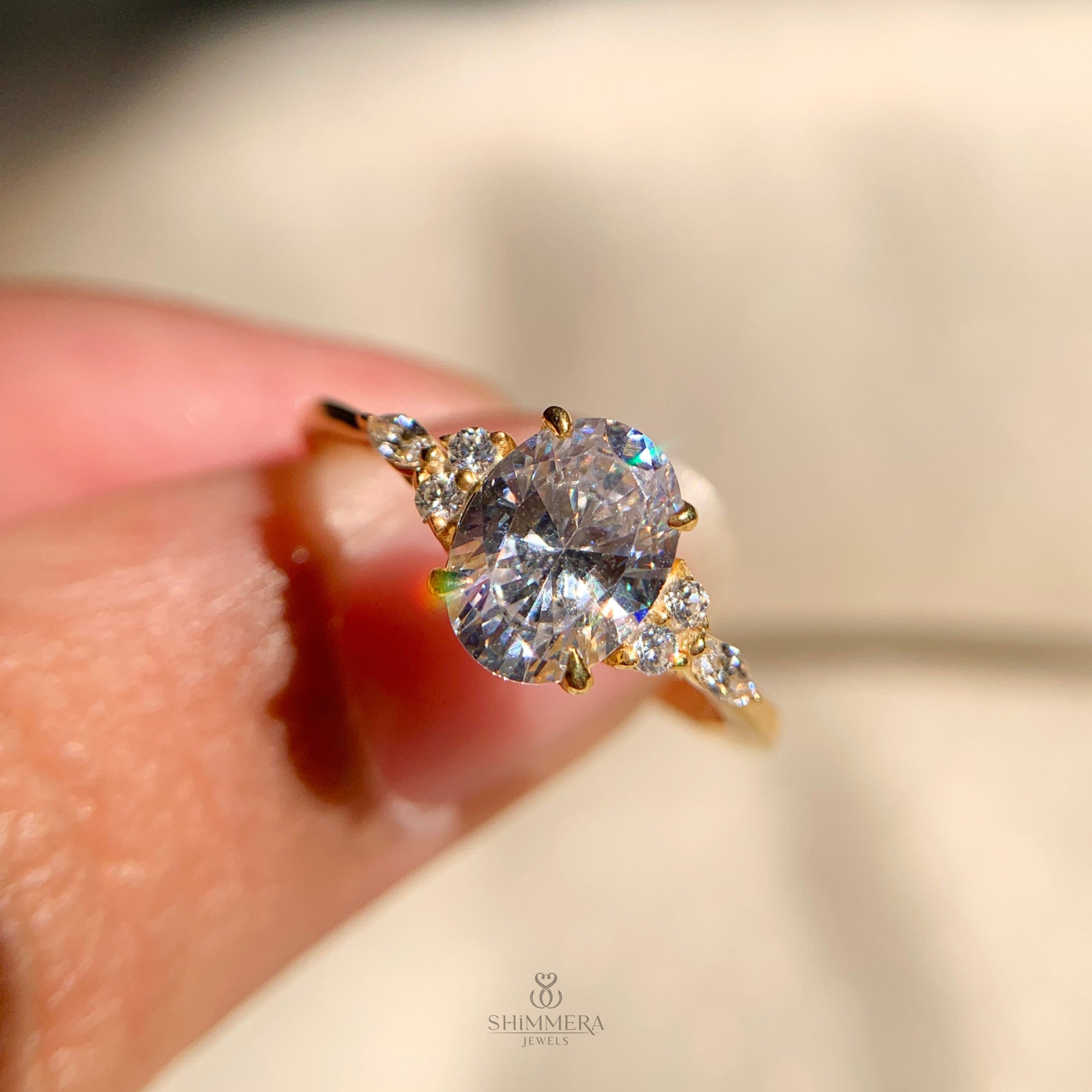 Classic oval engagement ring with side diamonds for bridal style