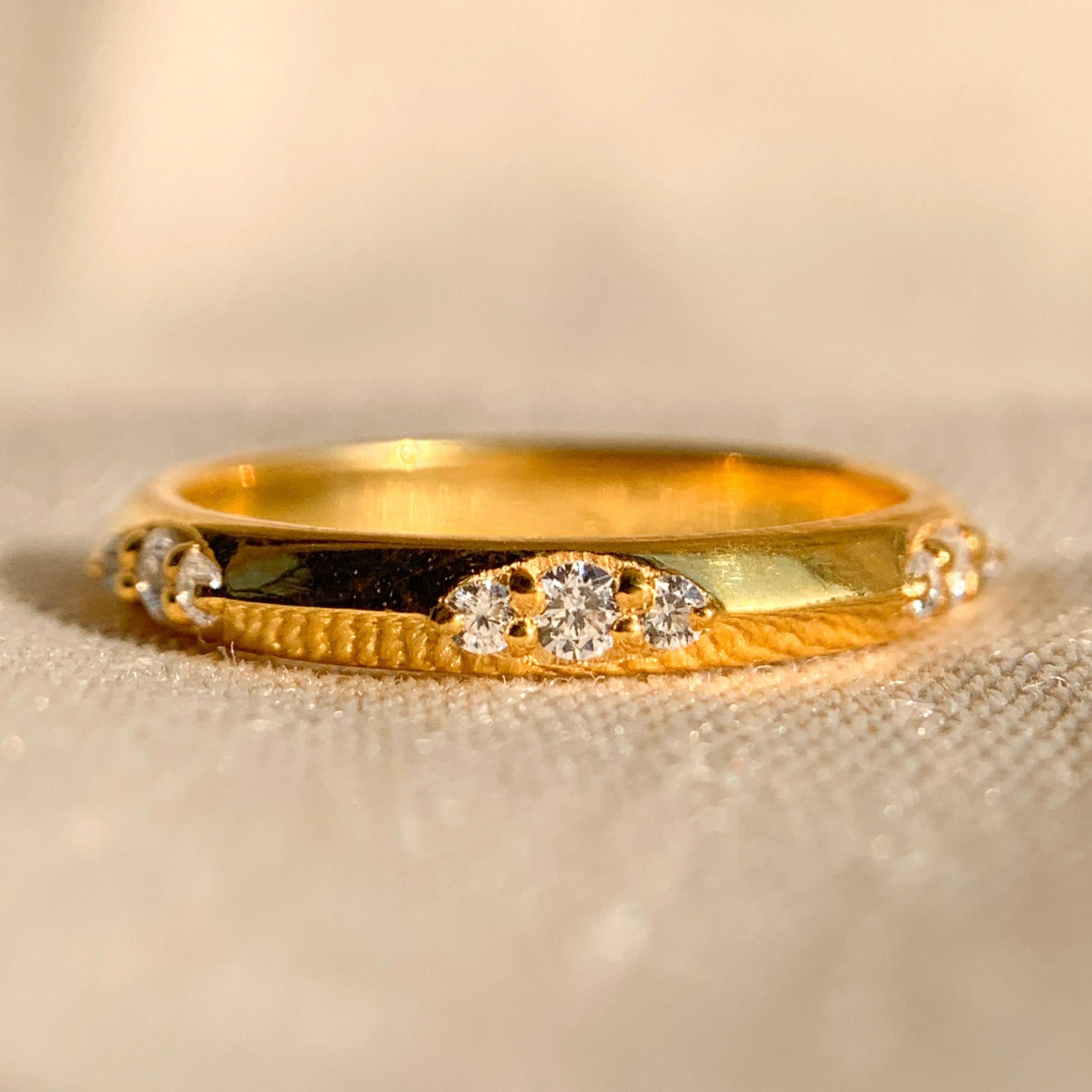 Elegant round diamond flush set wedding band in white gold