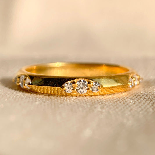 Elegant round diamond flush set wedding band in white gold
