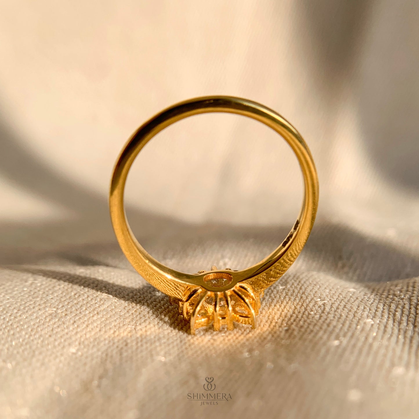 Unique engagement ring with pear and round diamond cluster design