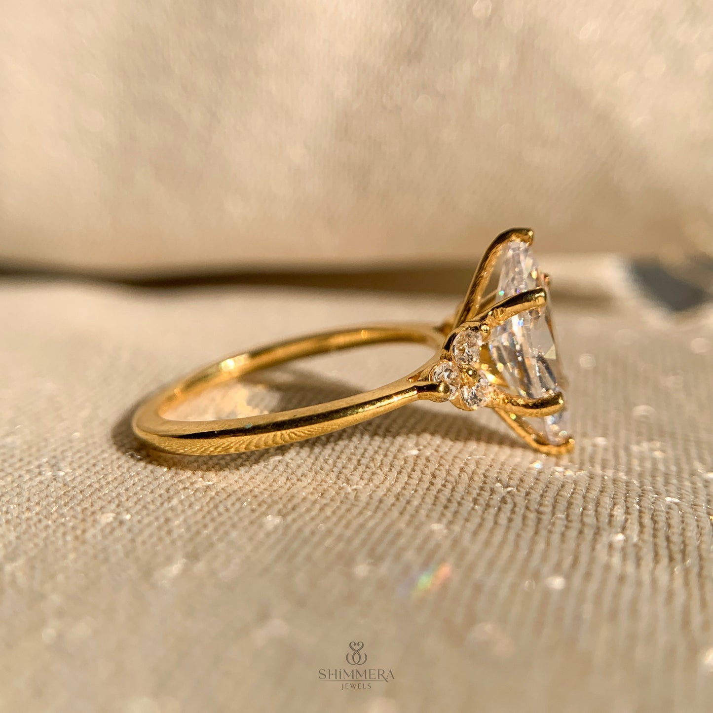 Marquise Engagement Ring With Round Side Stones