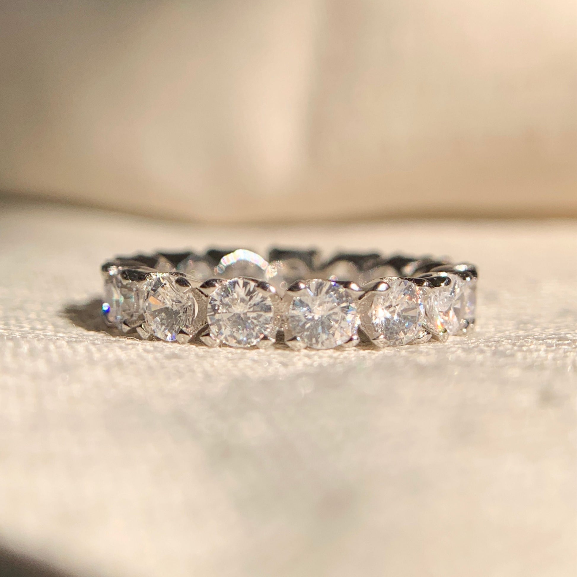Lab grown round diamond eternity band in polished white gold setting