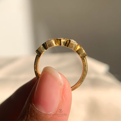 Modern bezel diamond wedding band in yellow gold finish