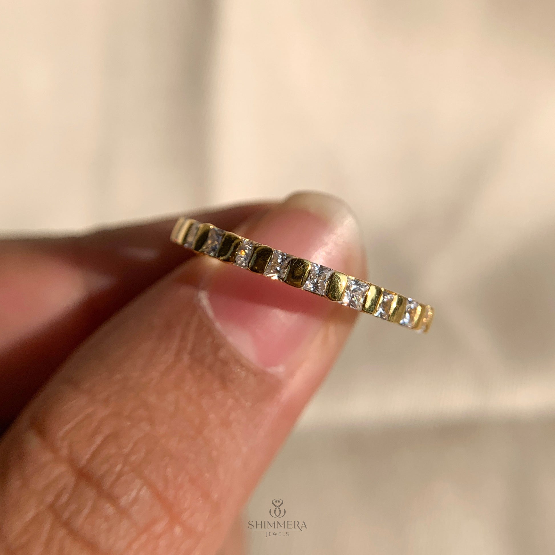 Timeless engagement ring featuring princess cut diamond in bar setting