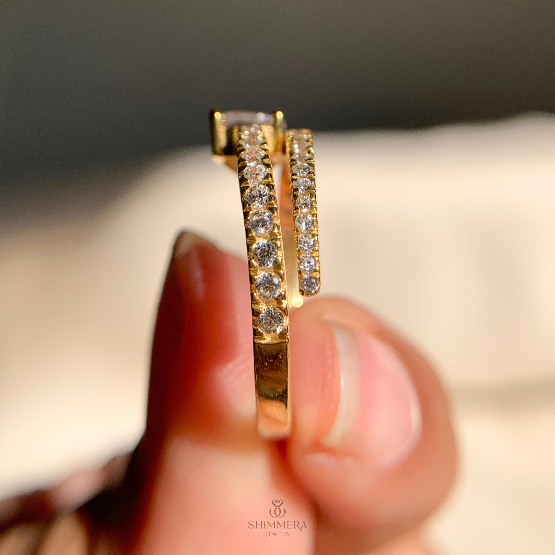 Unique east west pear solitaire ring with spiral shank and accent diamonds