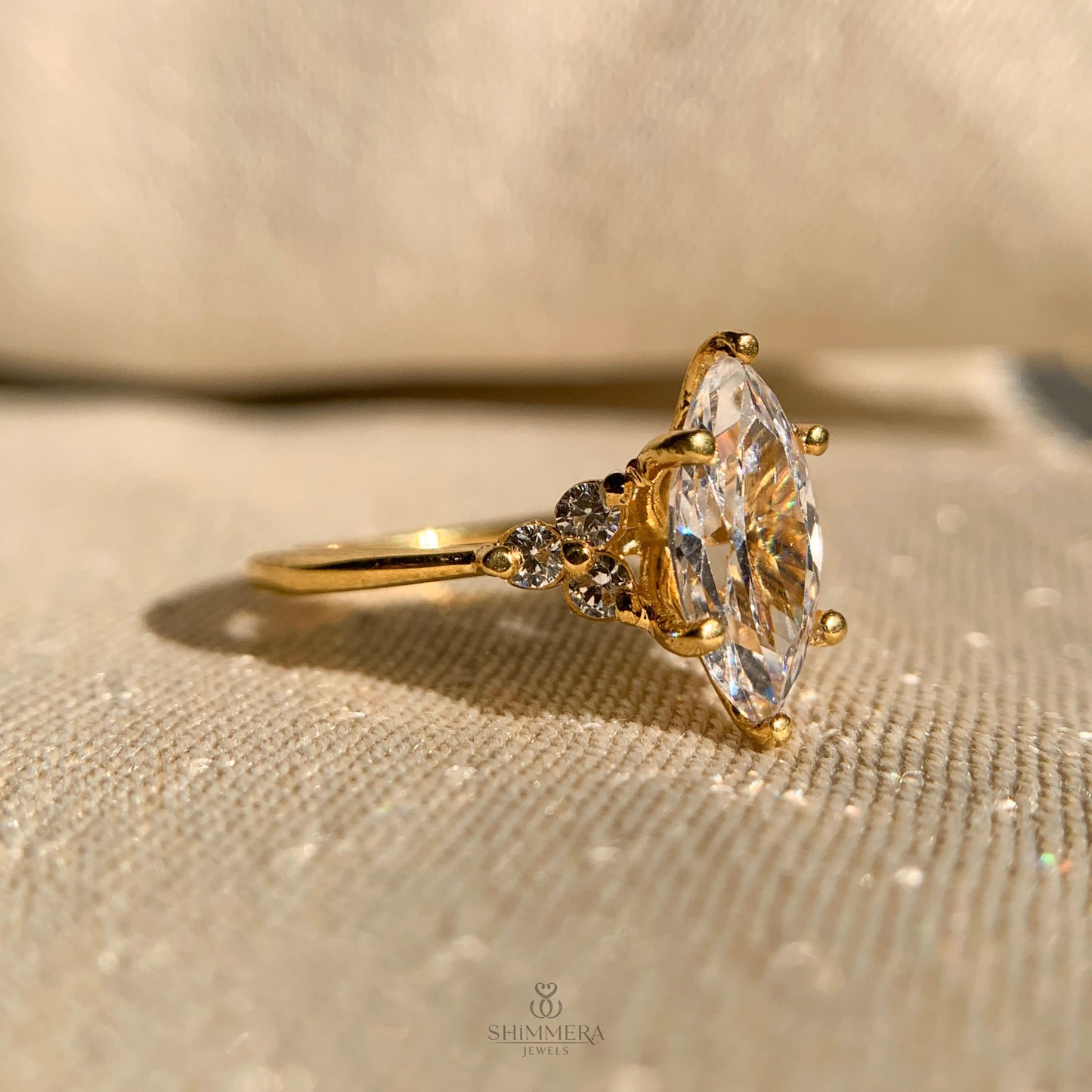 Marquise Engagement Ring With Round Side Stones