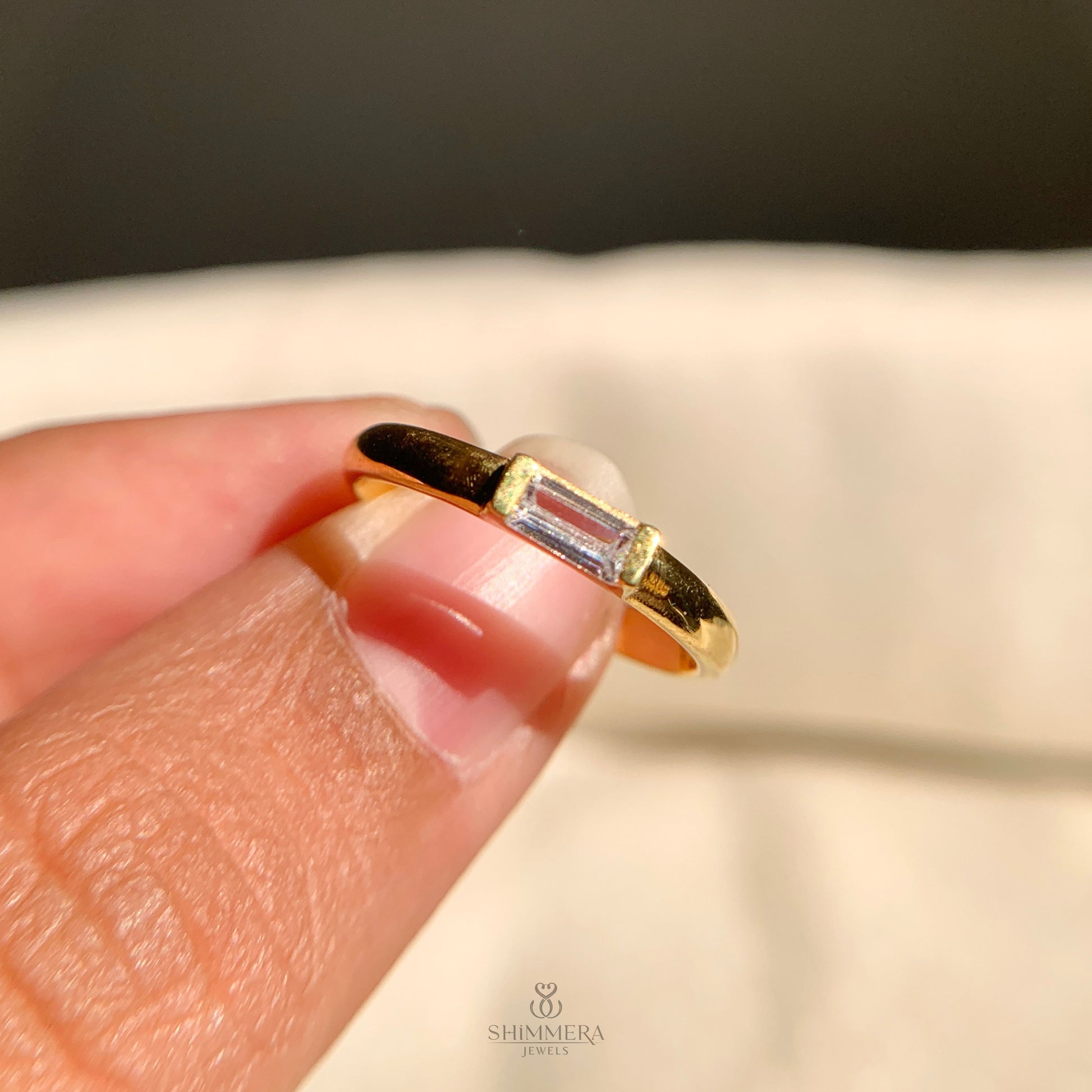 Timeless east-west baguette diamond wedding ring with polished finish